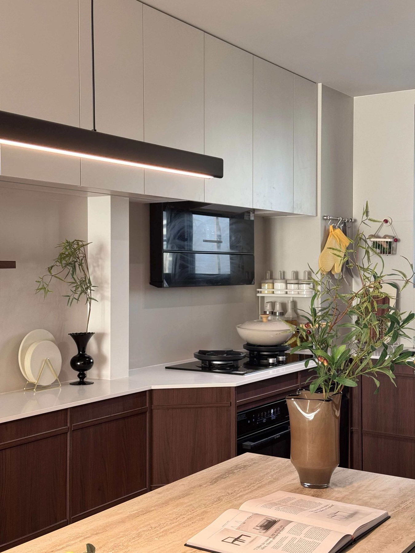 Walnut fluted kitchen base units with a built-in oven