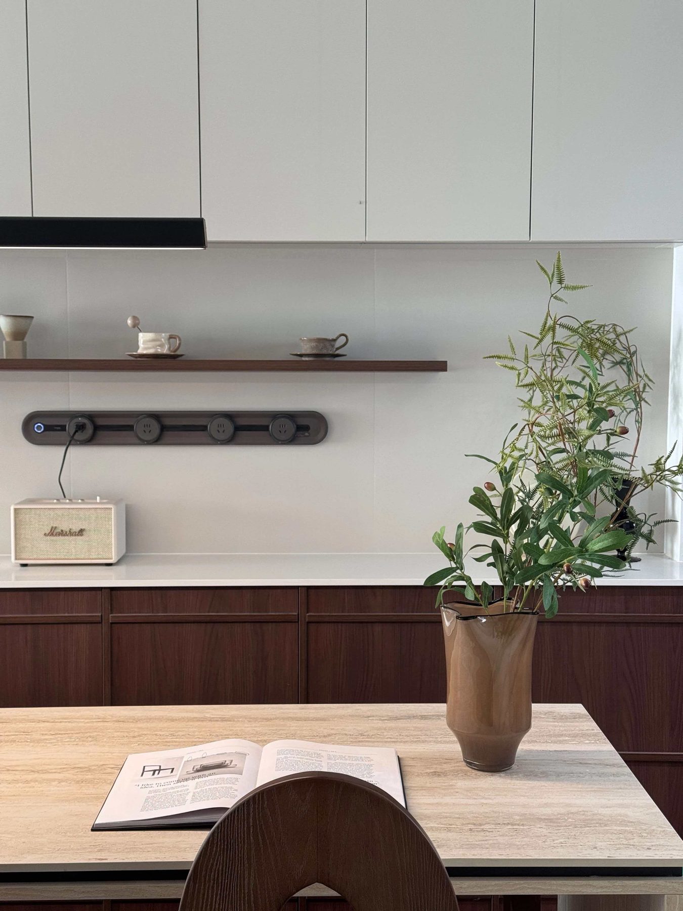 Kitchen worktop with a floating timber shelf above
