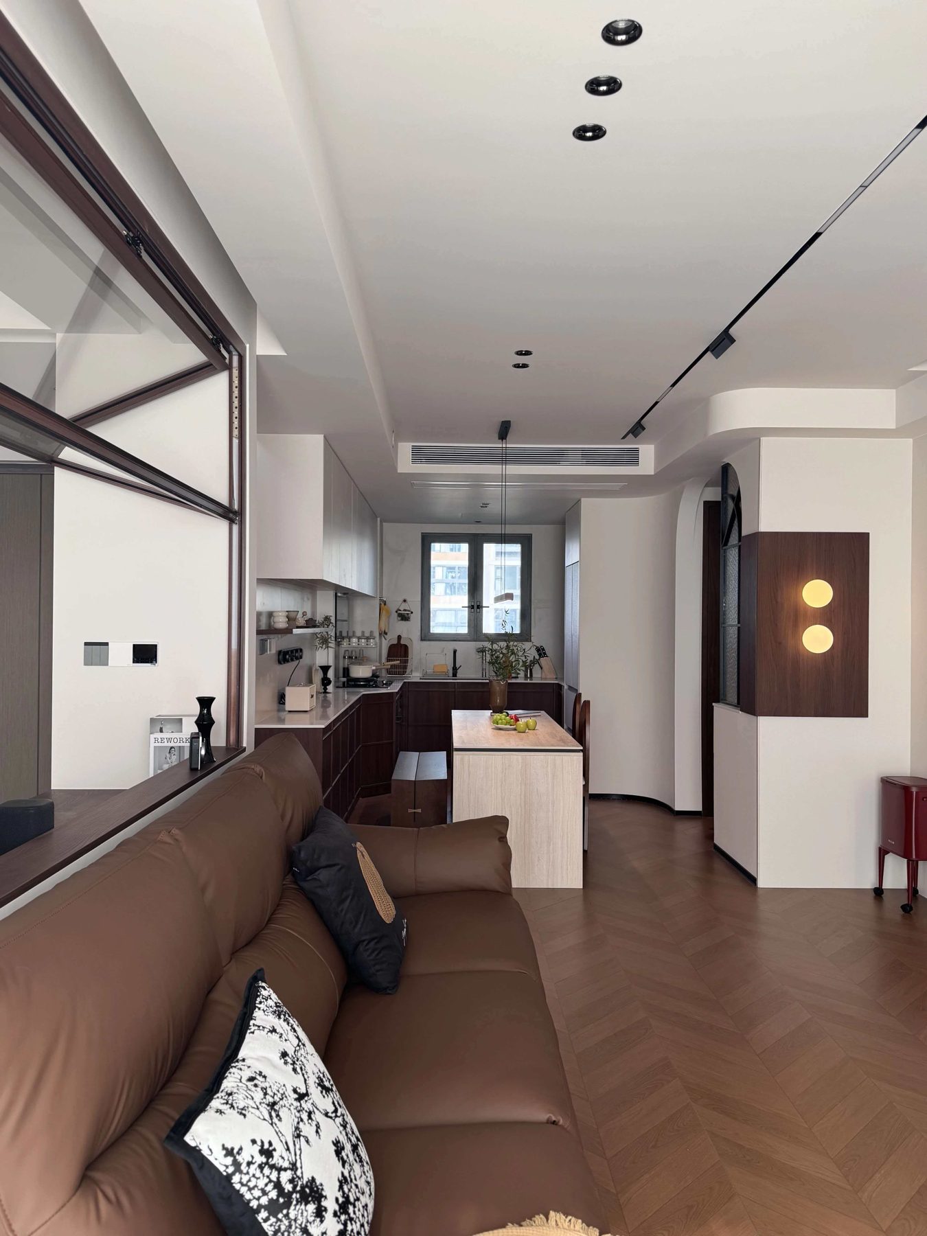 Living room with timber wall panelling behind the sofa