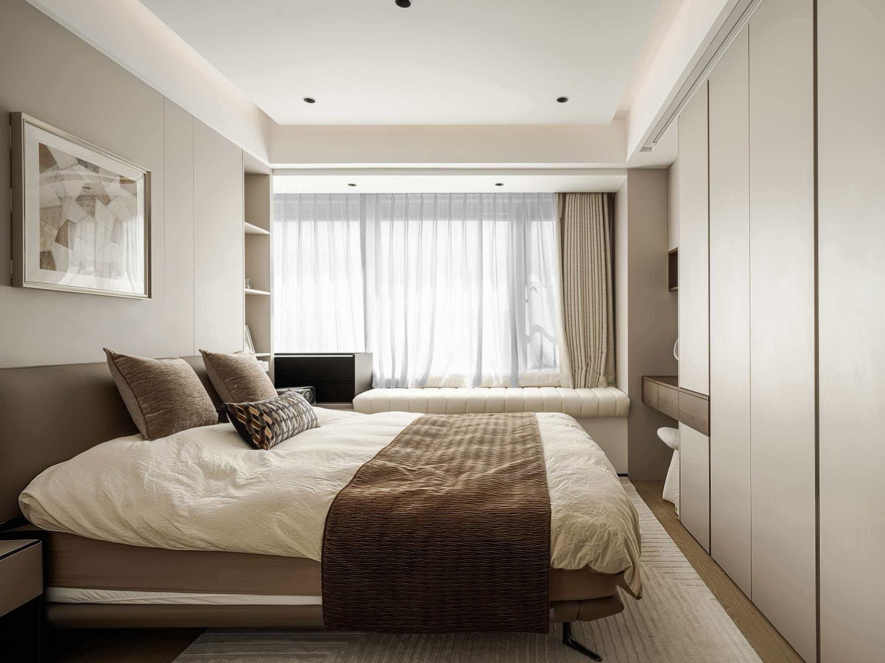 Master bedroom with floor-to-ceiling handle-free wardrobes
