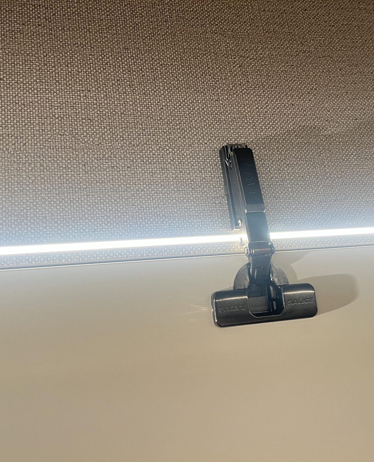 LED strip set into a groove in the cabinet side
